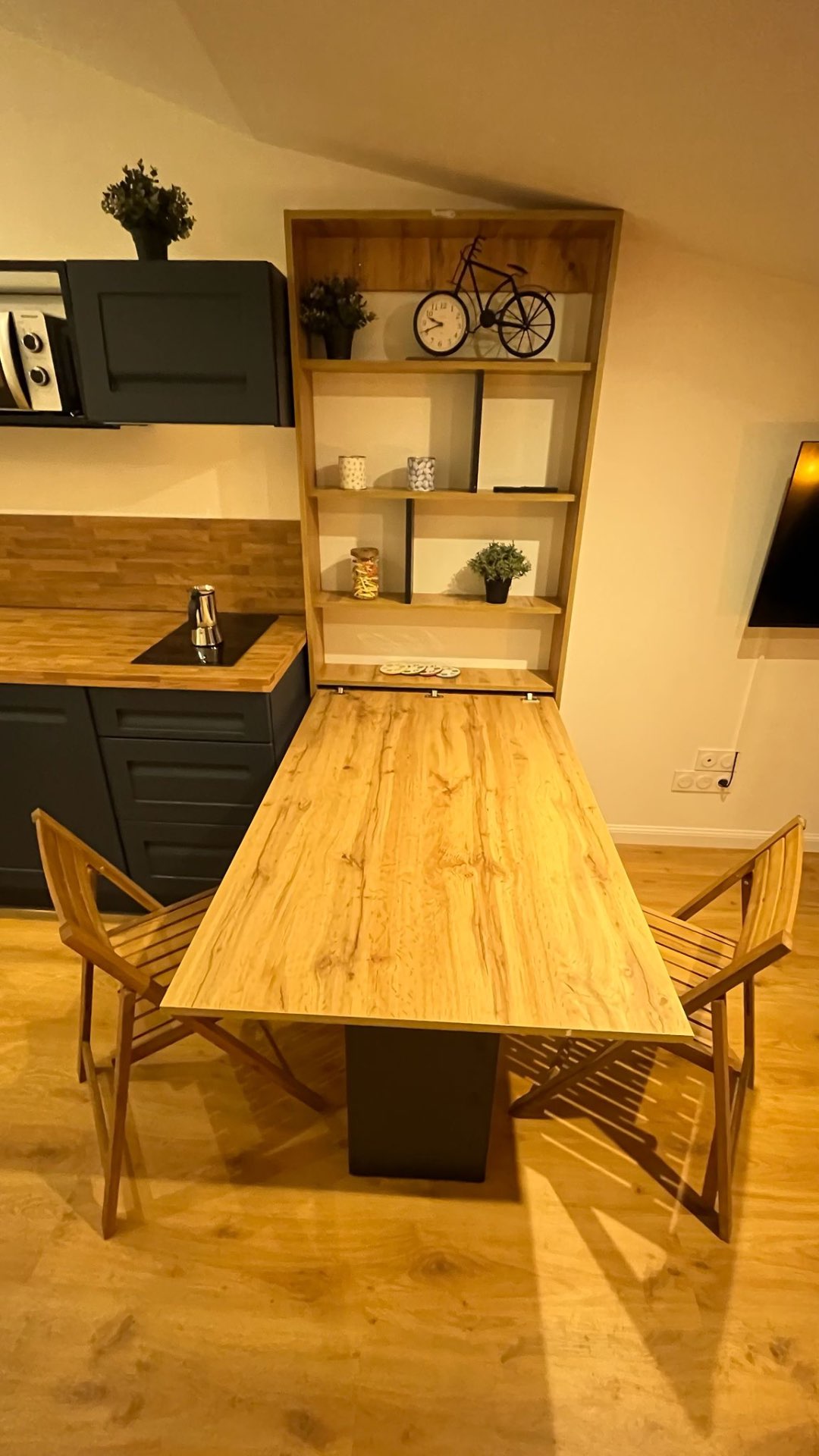Fold-out dining table and shelving